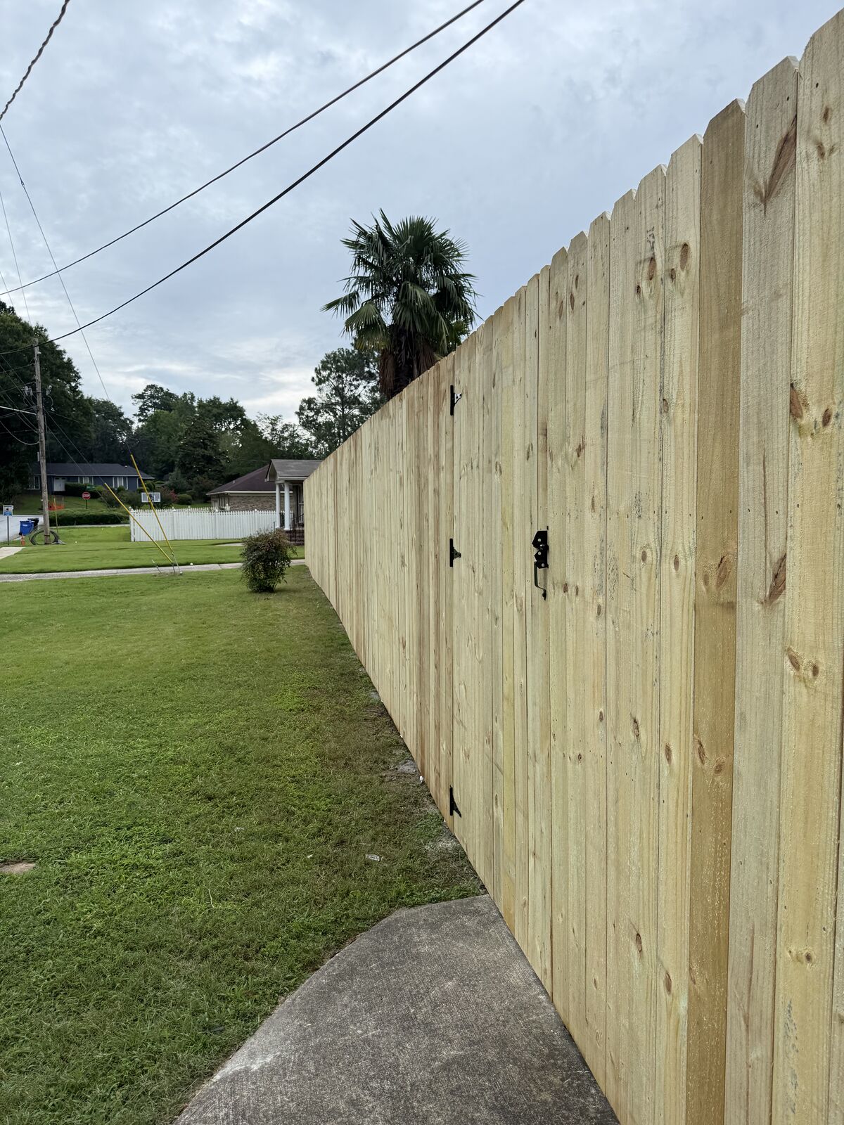 New wood privacy fence with a walk-through gate in Columbus, GA